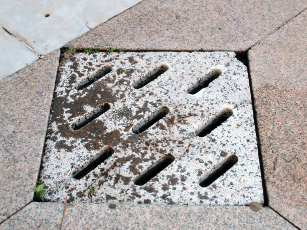 istock Sewer manhole on the urban asphalt road 900779916