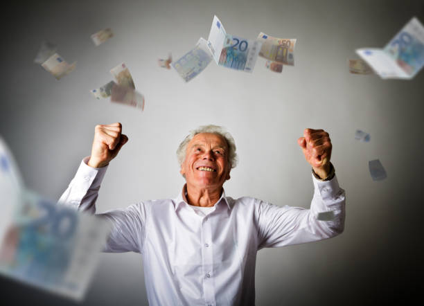 alter mann in weiß und sinkende euro-banknoten - falling senior adult people one person stock-fotos und bilder