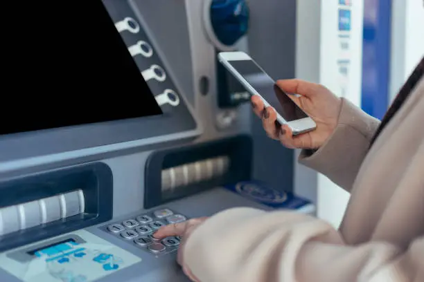 Photo of Cash dispenser with smartphone