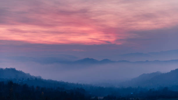 istock Foggy Landscape at Dusk 900799782