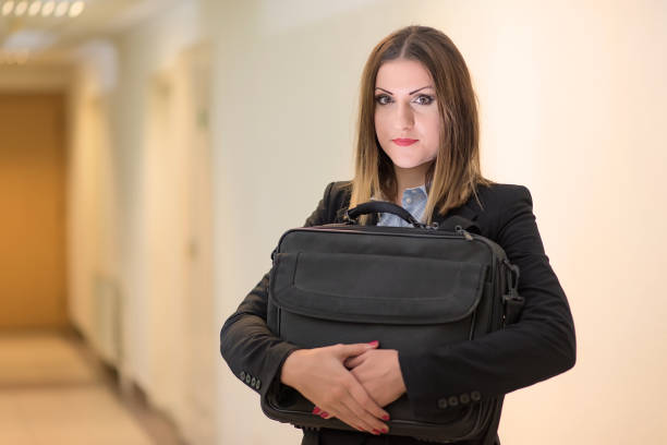 istock Cute business woman hold a notebook bag 900800208