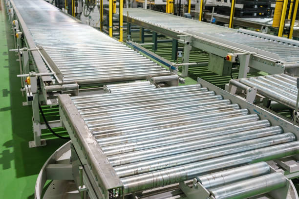 istock Crossing of the roller conveyor, Production line conveyor roller transportation objects. 900800556