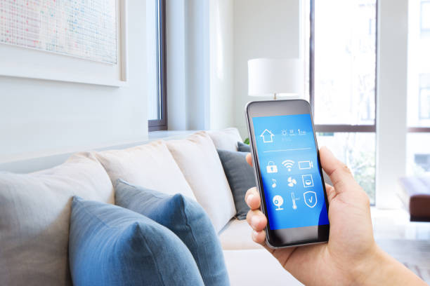 istock smart phone with smart home with modern living room 900801366