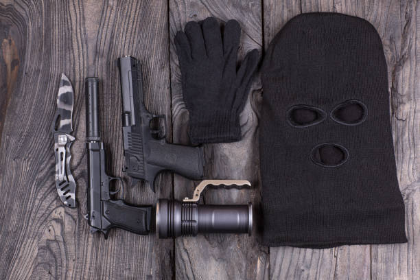 istock mask of the killer, pistol 900804496