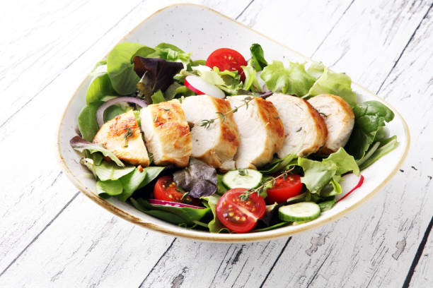 istock Chicken salad with leaf vegetables and cherry tomatoes 900816562