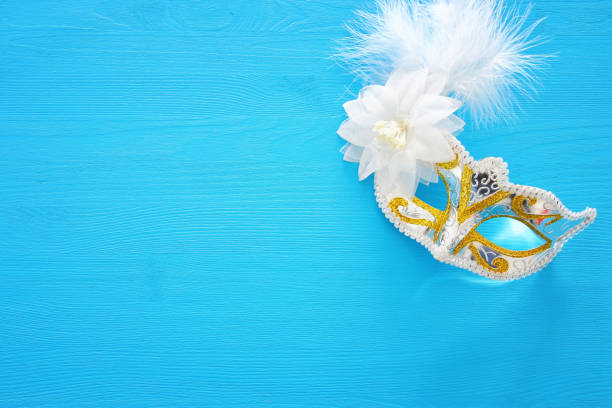 istock Image of elegant venetian mask over colorful background. 900817644