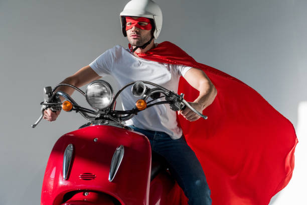 istock man in protective helmet and superhero costume 900820082