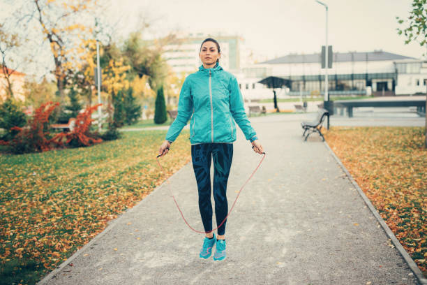 istock Sportswoman jumping rope 900824514
