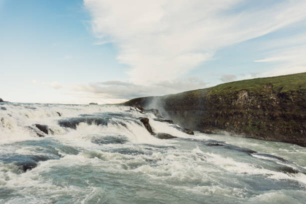 istock beautiful waterfall landscape with flowing river in Iceland 900824580
