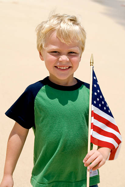 istock Boy with the American Flag on a Beach 90082947