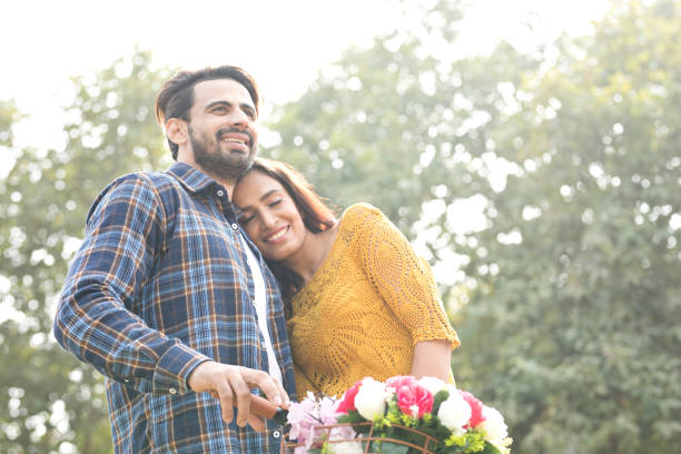 istock Happy couple at park 900829670