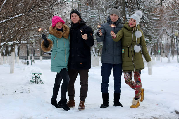 istock group of young people with sparklers 900832334