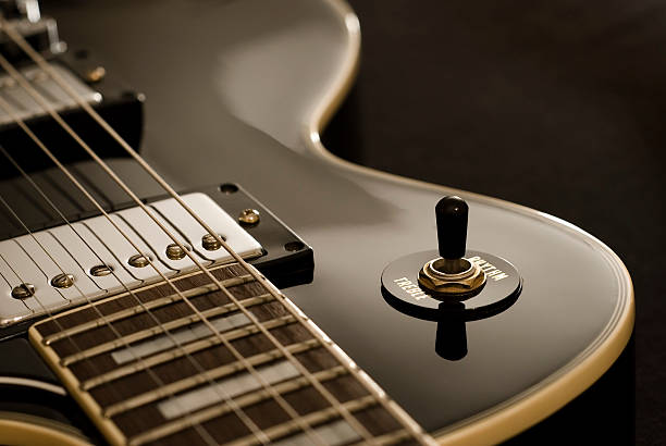 Light flowing on guitar in case on the floor. Camera film
