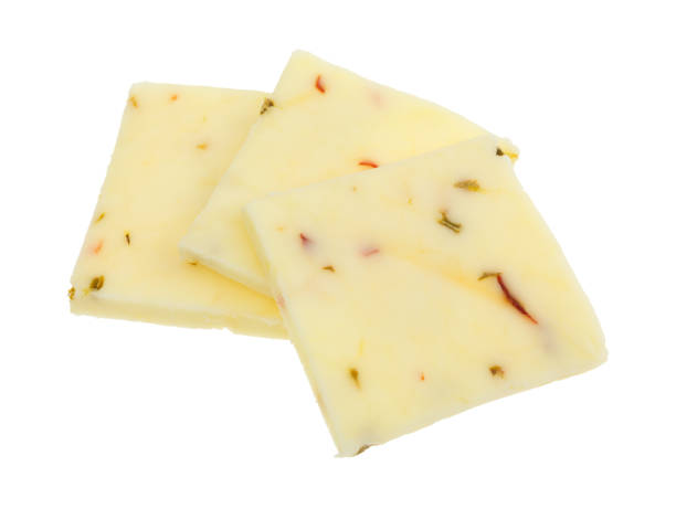 tre quadrati di formaggio jack al pepe su sfondo bianco - formaggio monterey jack foto e immagini stock