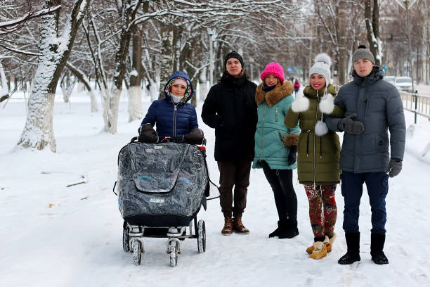 istock in the winter friends with a stroller 900833162