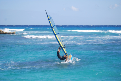 People practicing kitesurfing on the beach of Los Caños de Meca, next to the Trafalgar Lighthouse, Barbate, Cádiz