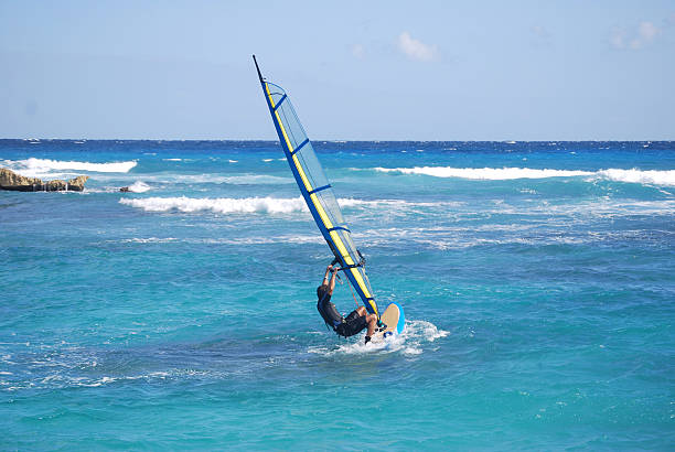 windsurfer demonstrates a water start  windsurfing stock pictures, royalty-free photos & images