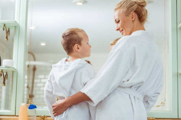 istock mother and little son in bathroom 900836598