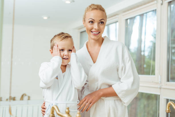 istock mother and little son in bathroom 900836658