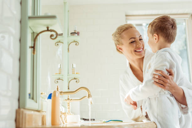 istock mother and son in bathroom 900836960