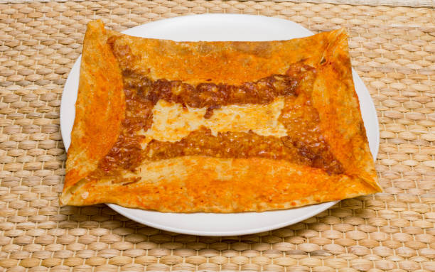 istock Delicious crepe with cheddar cheese served on white plate 900837114