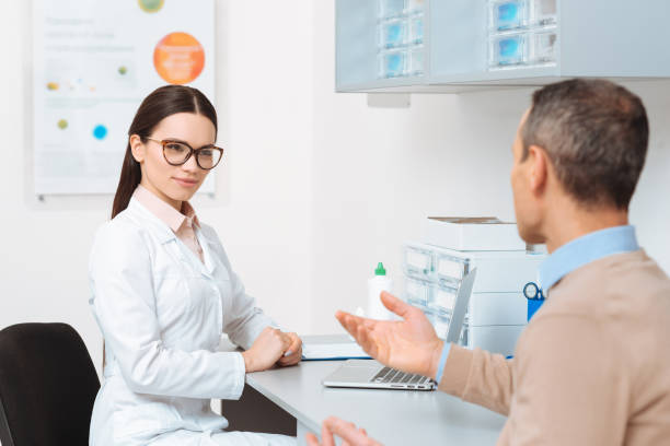 istock selective focus of patient at the doctors reception in clinic 900837722