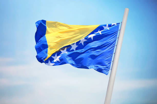 Flag of Bosnia and Herzegovina Flag of Bosnia and Herzegovina against the background of the blue sky bosnia and hercegovina stock pictures, royalty-free photos & images