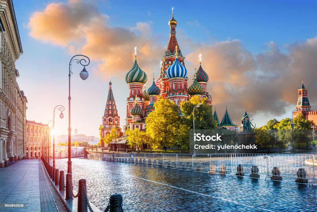 St. Basil's Cathedral  in the light of morning sunlight St. Basil's Cathedral with lanterns on Red Square in Moscow in the light of morning sunlight and pink clouds in the sky Kremlin Stock Photo