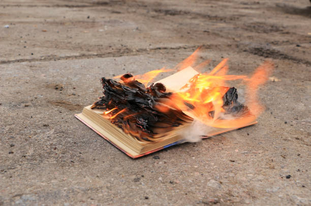 istock book with burning pages on a concrete surface 900840750