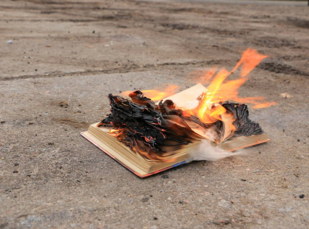 istock book with burning pages on a concrete surface 900840758