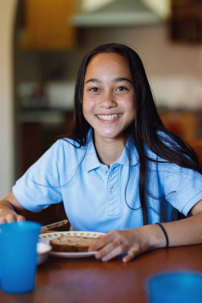 istock School Girl Having Breakfast 900841306