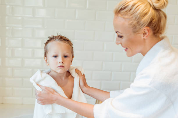 istock mother and son in bathroom 900842154