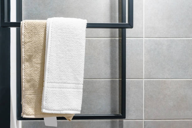 istock Clean white towel on a hanger in the bathroom 900848412