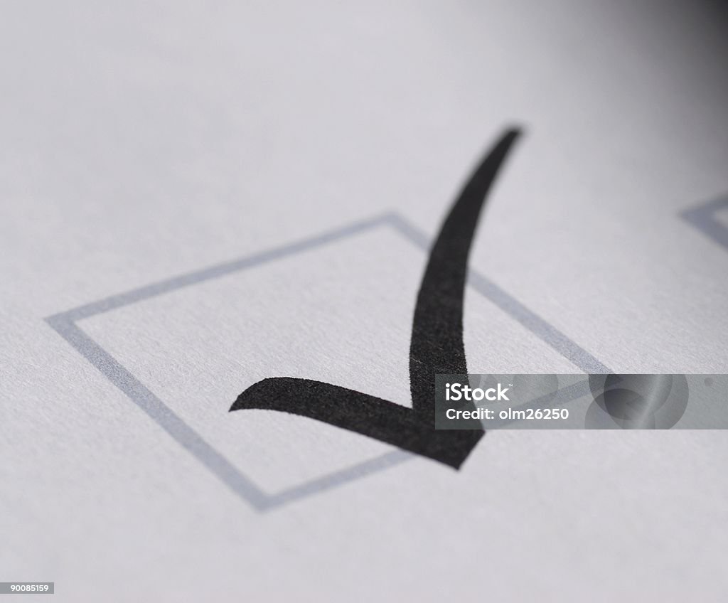 validation shape on a white paper part of a form - validation shape on a white paper - close up Agreement Stock Photo