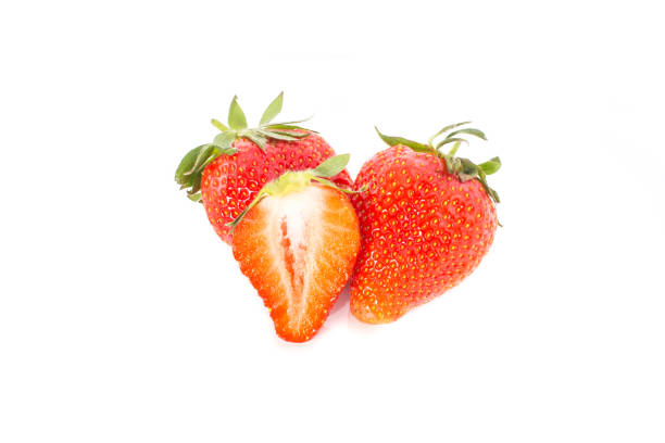 istock Strawberries and a slice cut out on white background. 900852874