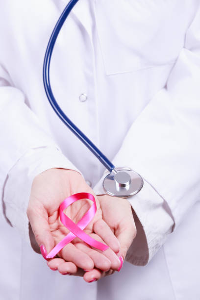 istock Female hands with pink ribbon 900860780