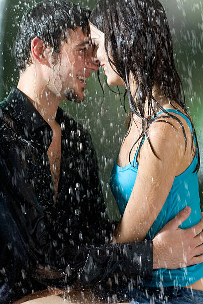 istock Young couple hugging under a rain, in passion 90086256