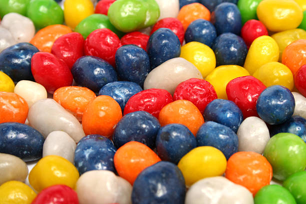 istock Horizontal background made of multi-coloured sweets with raisin 90086292