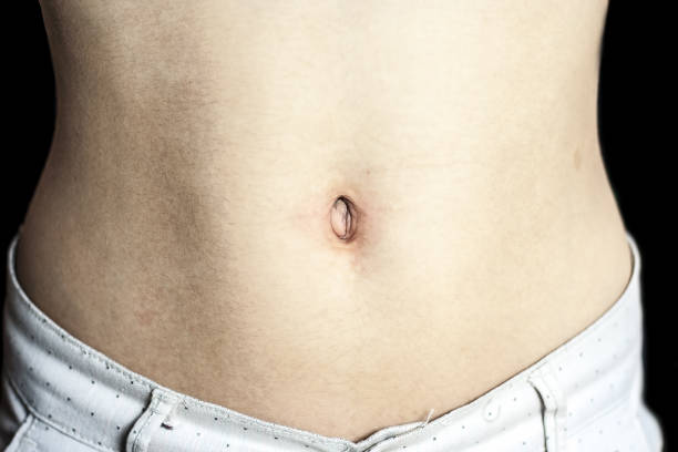 istock Close up of human stomach. 900864668