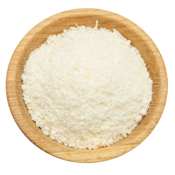 grated parmesan cheese in wooden bowl on white background - parmesan cheese imagens e fotografias de stock
