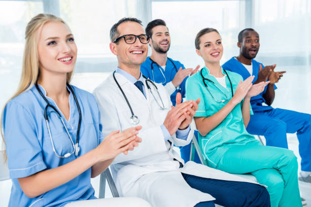 istock doctors listening to lecture 900865262