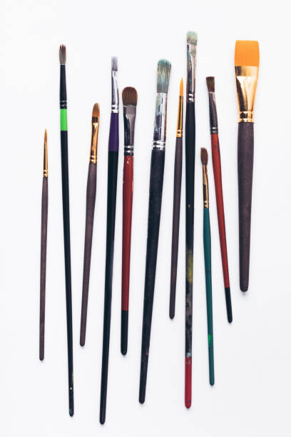 istock close-up view of various professional paint brushes isolated on white 900869774