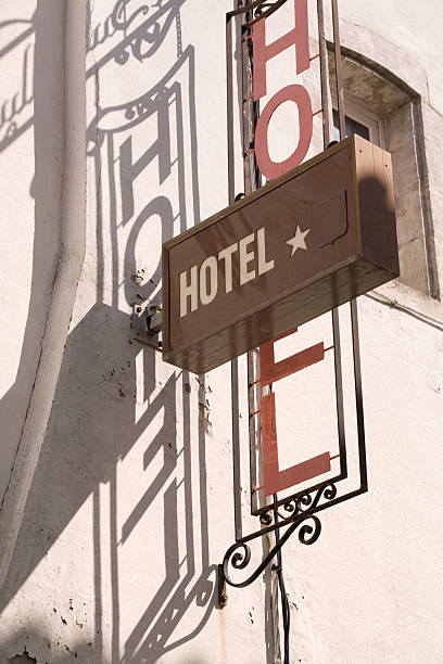 istock hotel sign and its shadow on a white wall 90087263