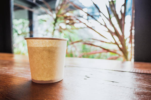istock A paper cup on a wooden table. 900874630