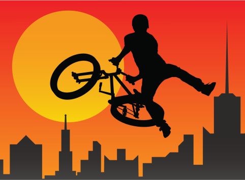 Silhouette of the bicyclist executing a stunt. Contain large JPEG.