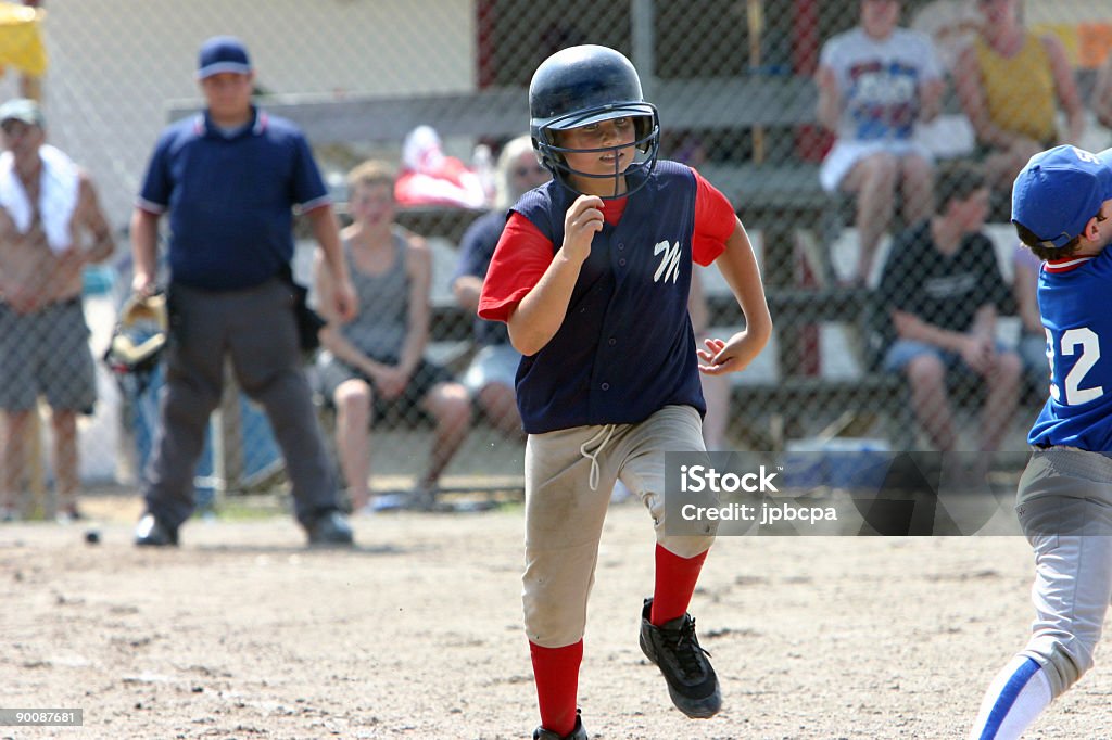 running to firstbase  Adolescence Stock Photo