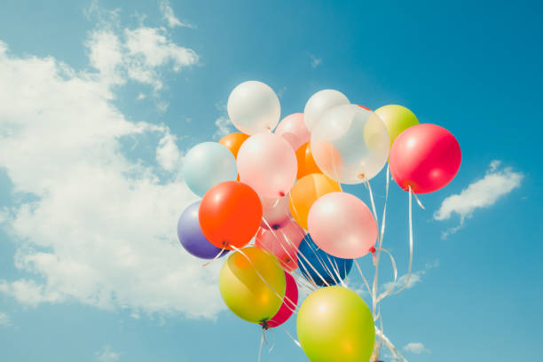 Vintage colorful balloon Colorful balloons done with a retro instagram filter effect. Concept of happy birth day in summer and wedding, honeymoon party use for background. Vintage color tone style carnival celebration event photos stock pictures, royalty-free photos & images