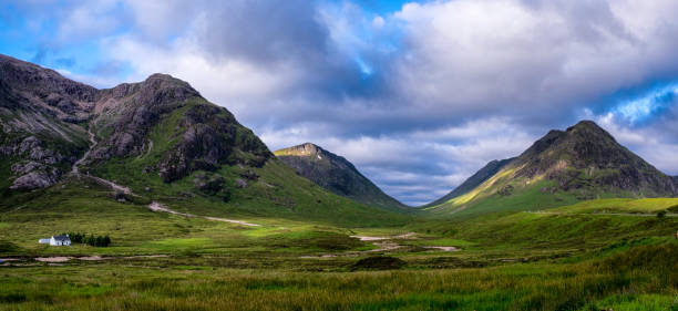 Glen Coe Panoramic The dramatic landscape of Glen Coe in Scotland. buachaille etive mor photos stock pictures, royalty-free photos & images