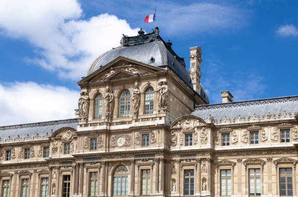 The City of Paris France on March 29, 2014:  Statue on the Louvre Museum grounds at dusk in Paris France
