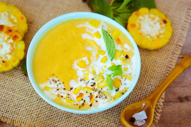 istock Vegetarian corn cream soup in the bowl on the rustic table 900893976